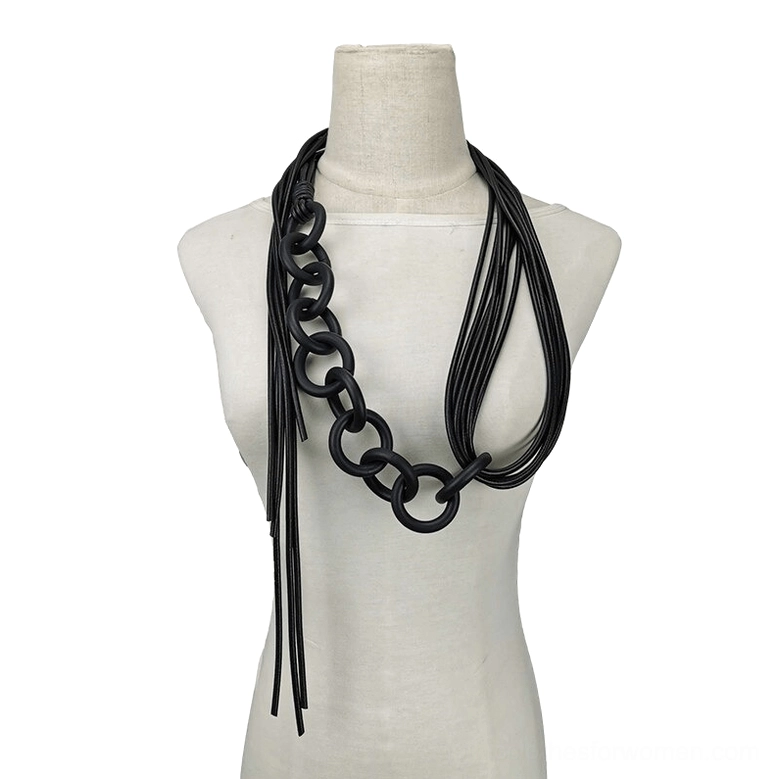 Handmade black gothic necklace featuring asymmetrical layered design with mixed chain and tassel elements on mannequin