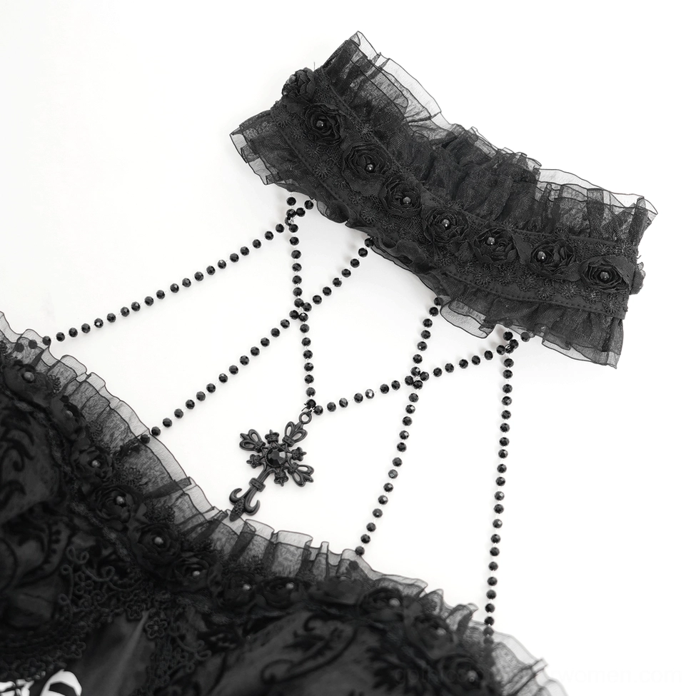 Close-up detail of gothic dress neckpiece showing beaded cross pendant and ruffled floral choker accessory