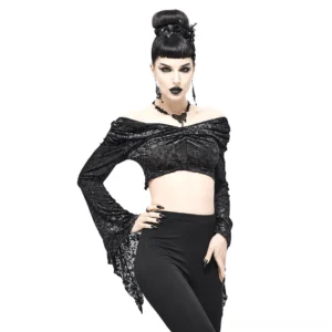 Front three-quarter view of black gothic off-shoulder crop top with twisted front neckline, flared lace sleeves, and gathered details on model with gothic styling