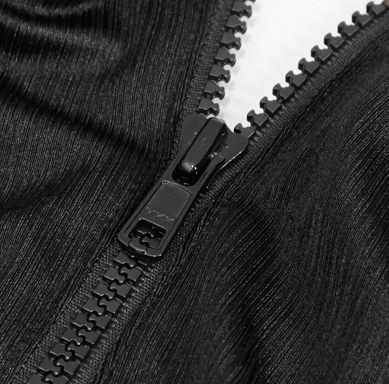 Black gothic one-piece swimsuit elastic and strap detail showing spaghetti strap construction