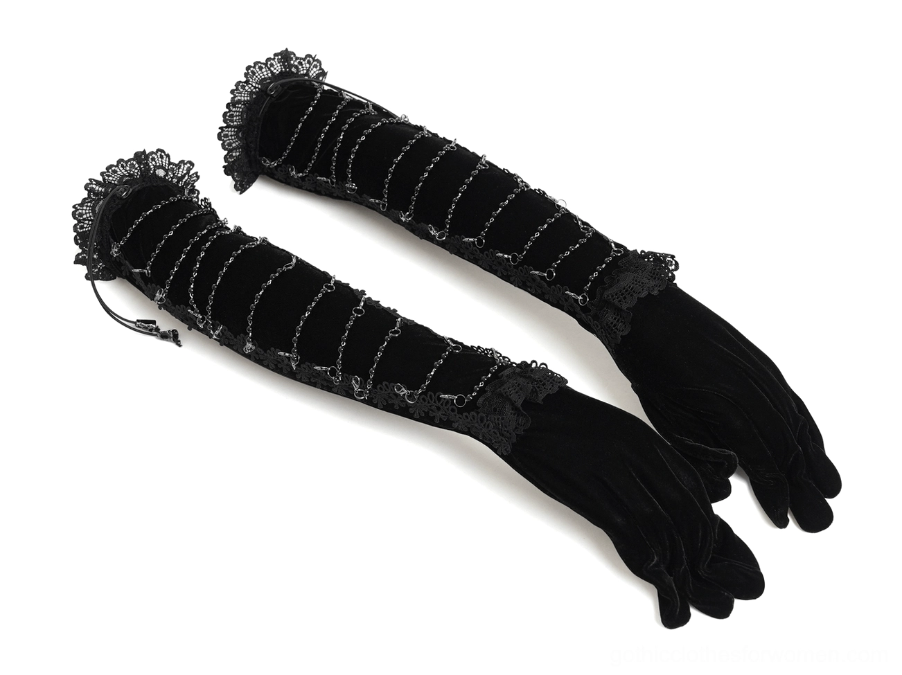 Chain-adorned black gothic opera gloves in flat lay view showing spiral metal chain embellishments, drawstring pendant details, and premium velvet construction