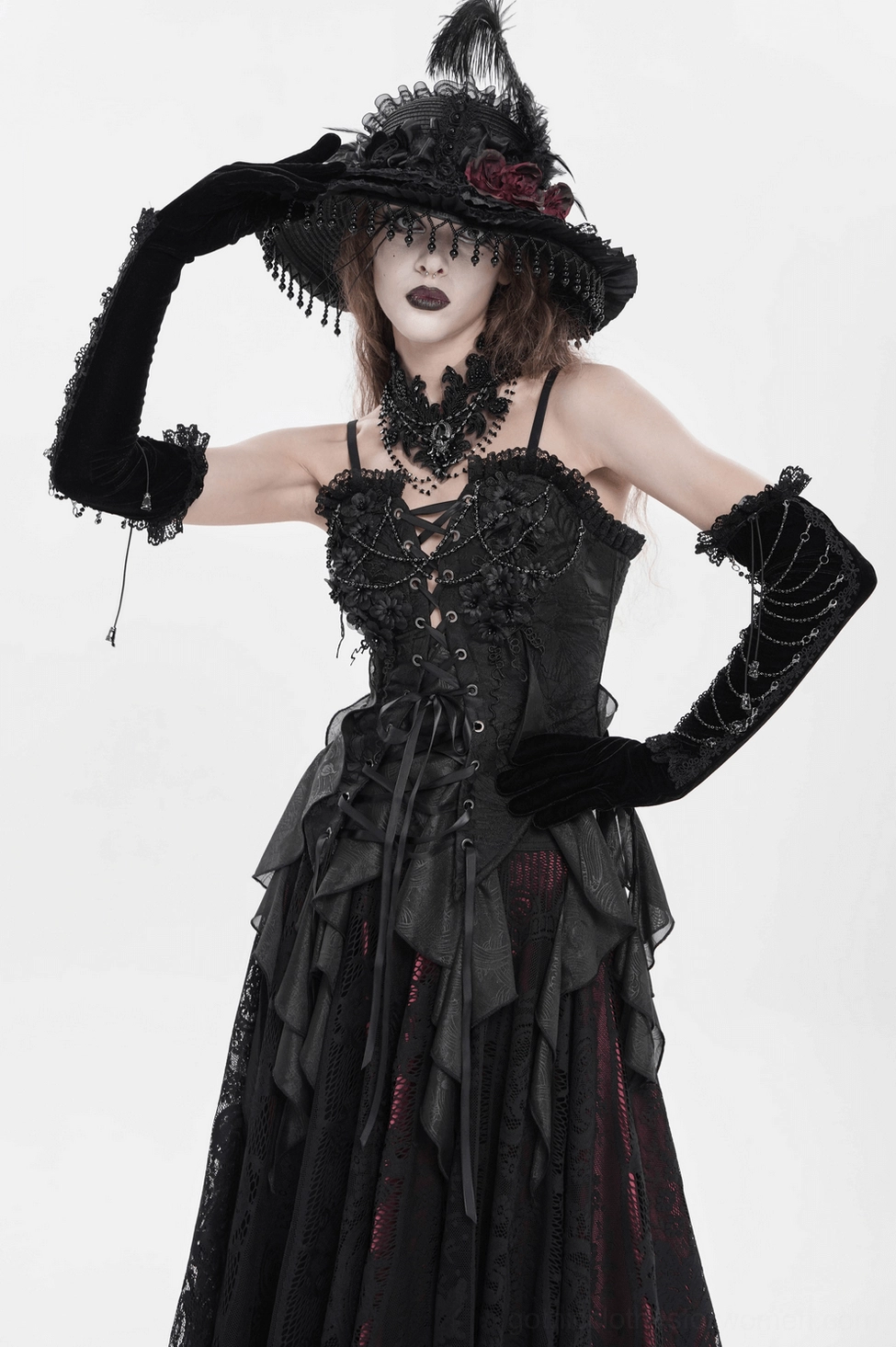 Black velvet gothic opera gloves product lifestyle shot demonstrating the elbow-length coverage, metal chain embellishments, and lace trim design