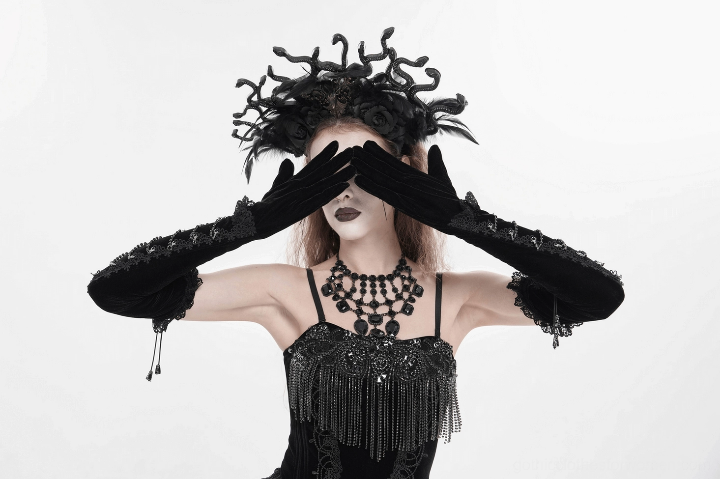 Size reference photo of black gothic opera gloves showing actual dimensions, wrist circumference fit, and upper arm coverage on model