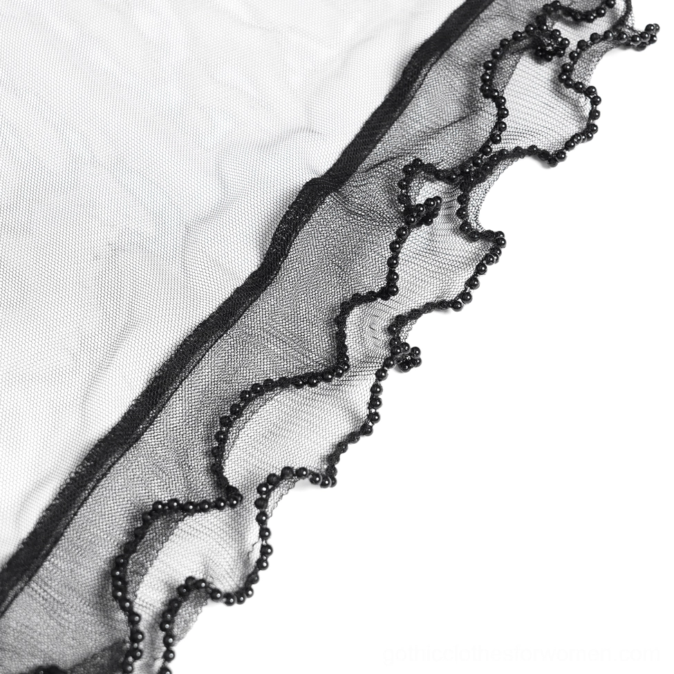 Black gothic flocked palazzo pants detail shot showing layered lace and mesh draping elements