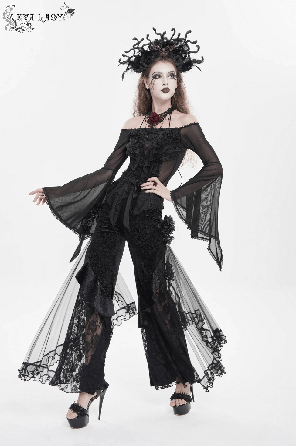 Black gothic palazzo pants profile view showing dramatic leg volume and flowing mesh train drape