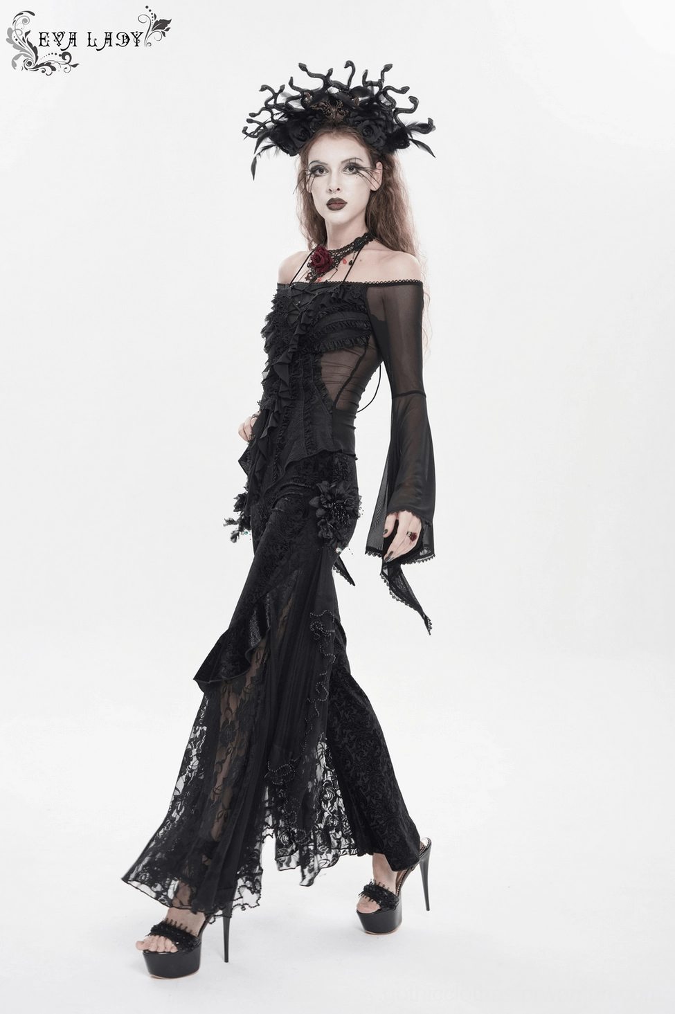 Gothic flocked palazzo trousers side view detail of asymmetrical ruffle and flower embellishment placement