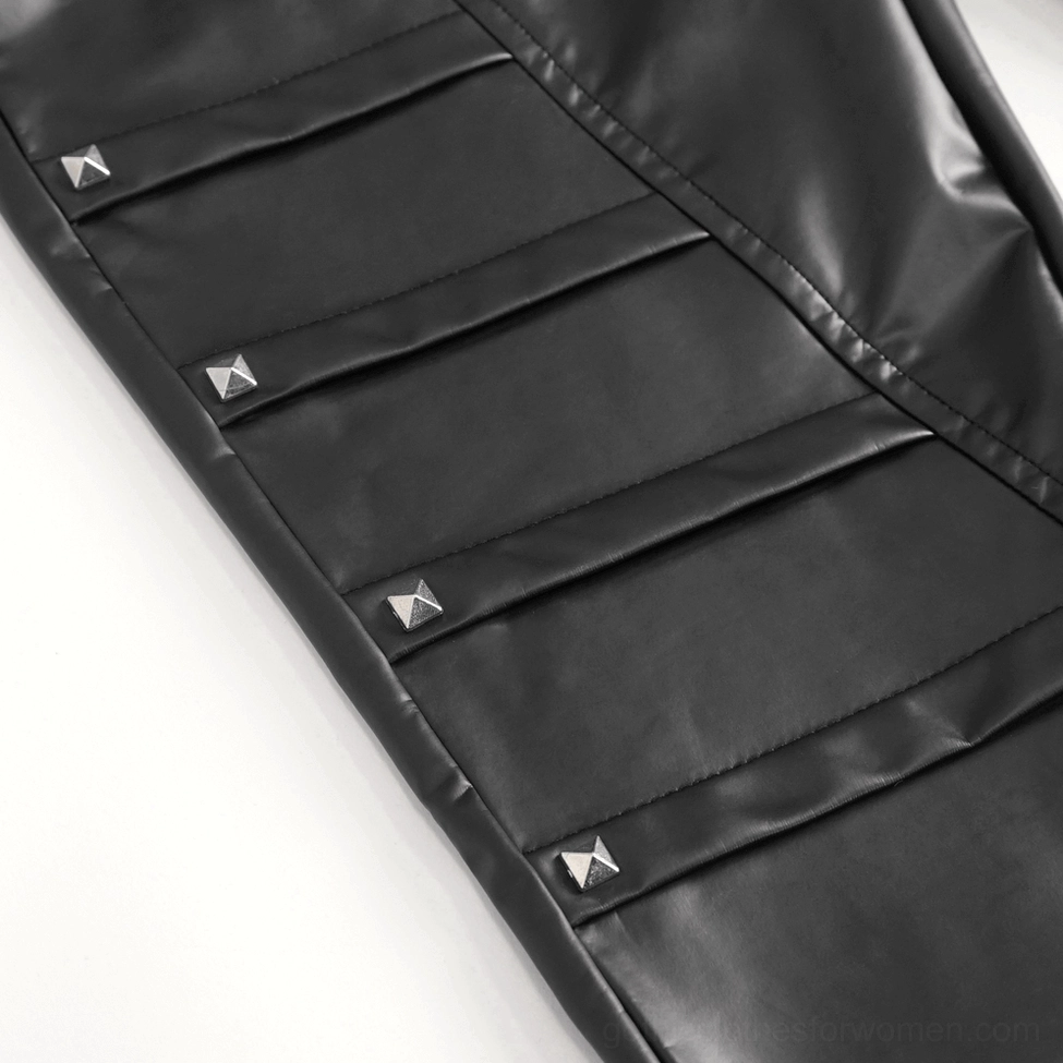 Women's gothic faux leather pants detail shot showing heart chain and hardware accents