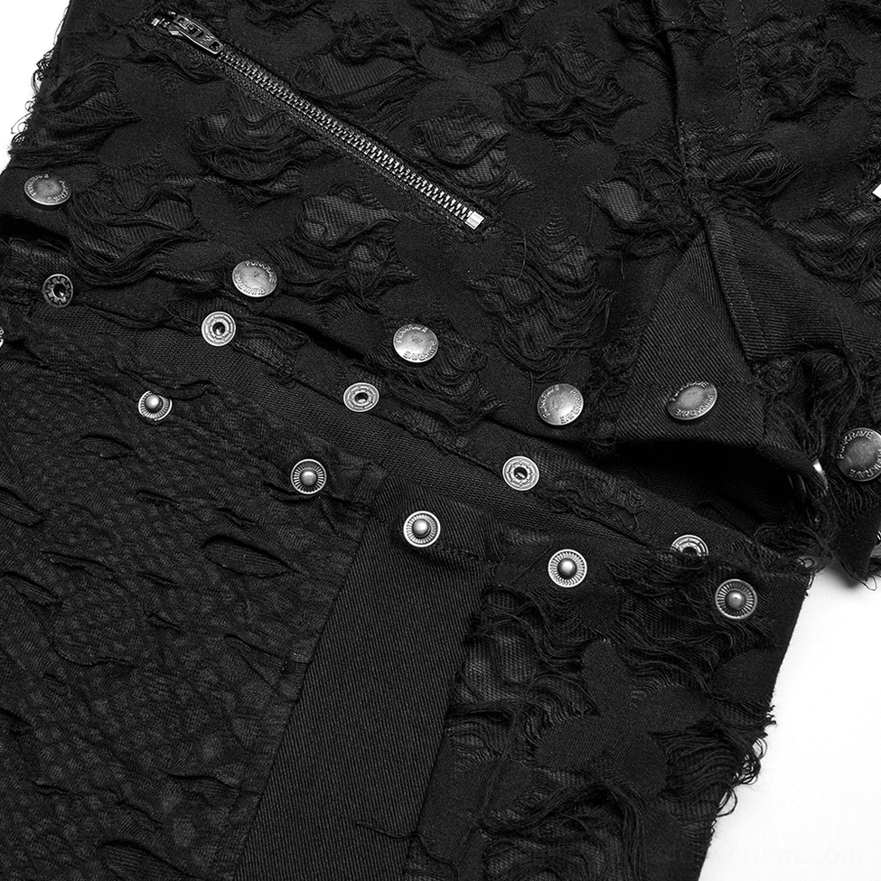 Close-up detail of black gothic pants metal zipper studs buttons and tattered floral textile