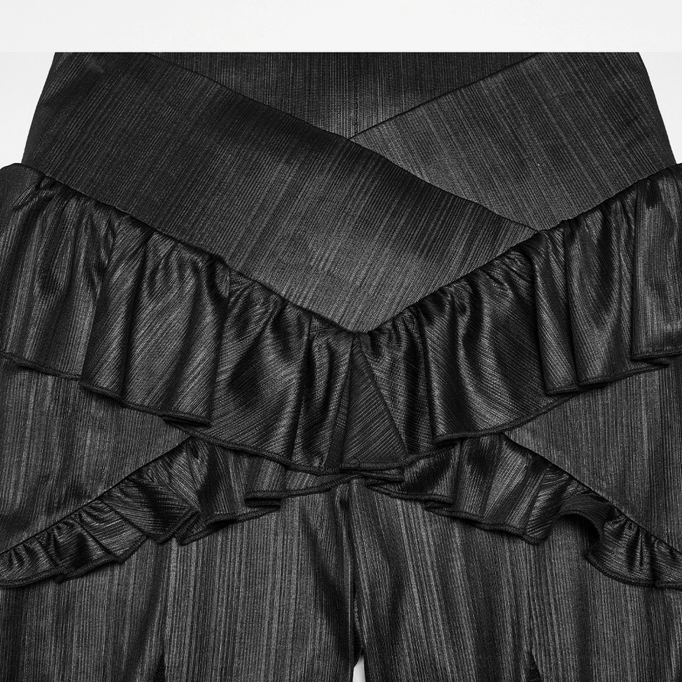Detailed close-up flat lay of gothic pants cross-over waist featuring double ruffle trim and textured striped fabric construction