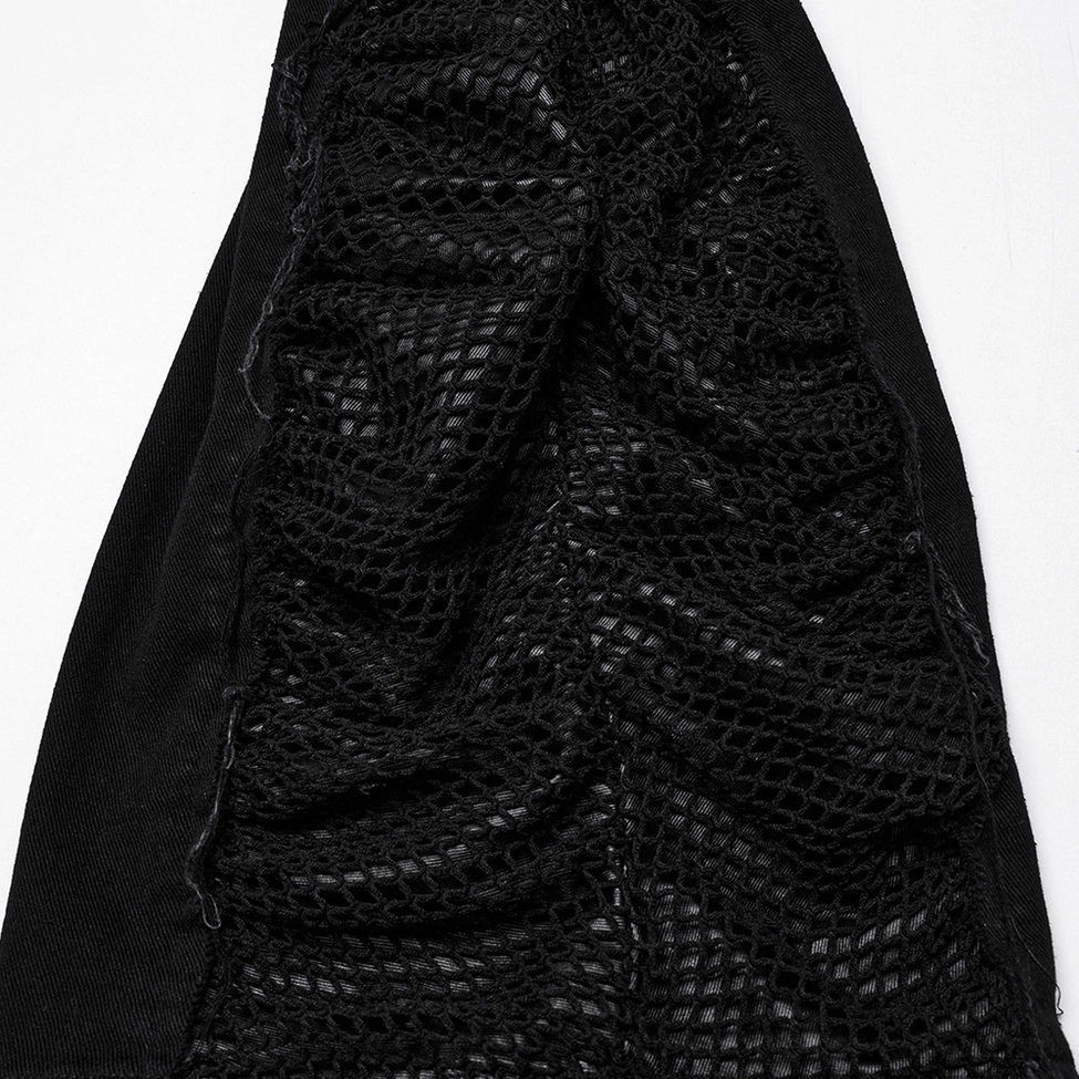 Close-up texture detail of gothic pants black mesh and ruched denim fabric