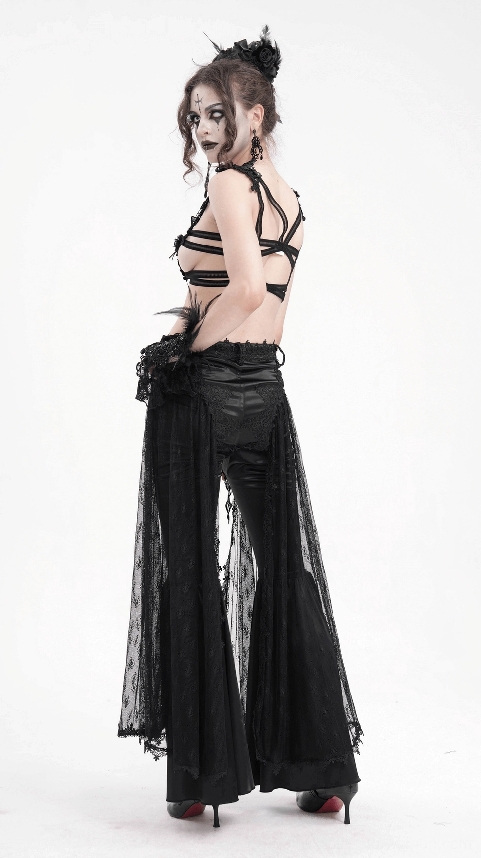Black lace bell-bottom gothic pants flared hem detail displaying dramatic movement and sheer overlay effect