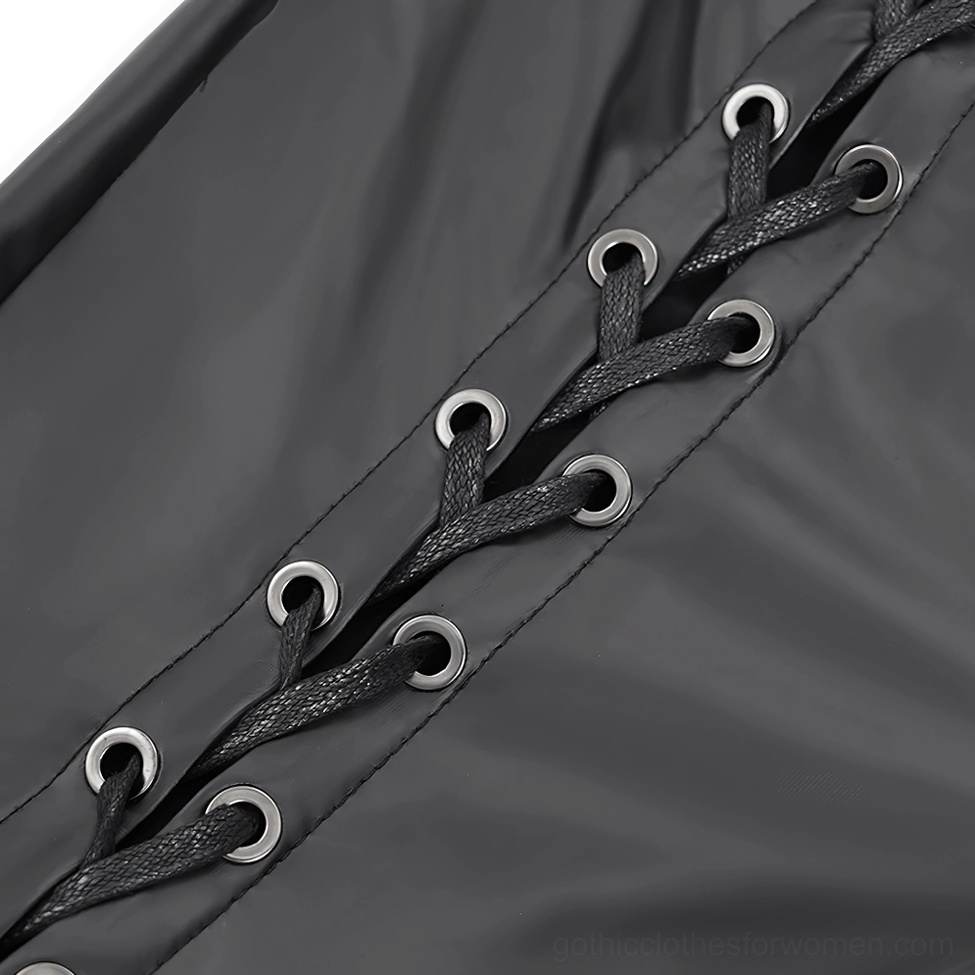 Close-up of metal grommet eyelets and black lace-up ties on gothic pants, side lacing detail