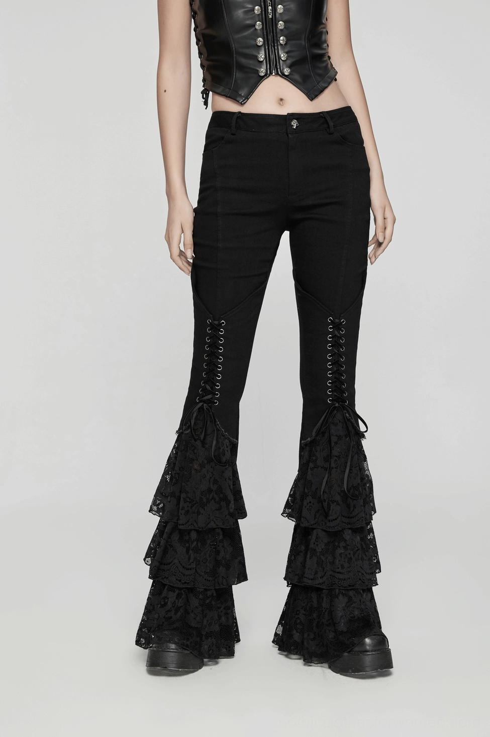 Black gothic lace flared pants detail showing layered lace ruffles and flare width of hem