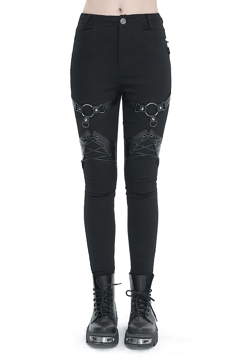 Black gothic slim-fit pants lifestyle shot showing fit profile and alternative fashion styling