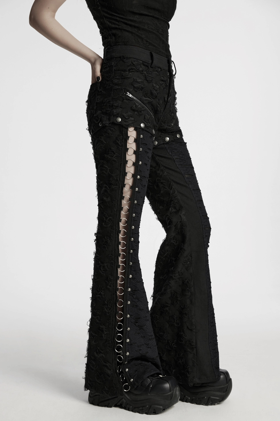 Black gothic tattered pants with metal studs and O-rings detail shot styling
