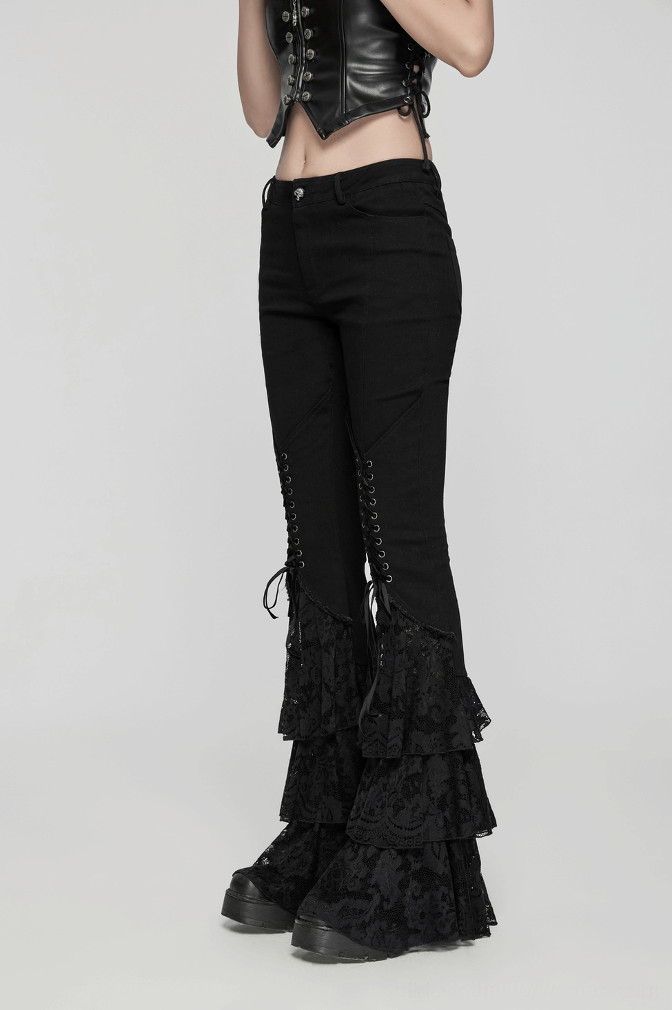 Black gothic lace flared pants close-up of multi-tier lace construction and hem detail