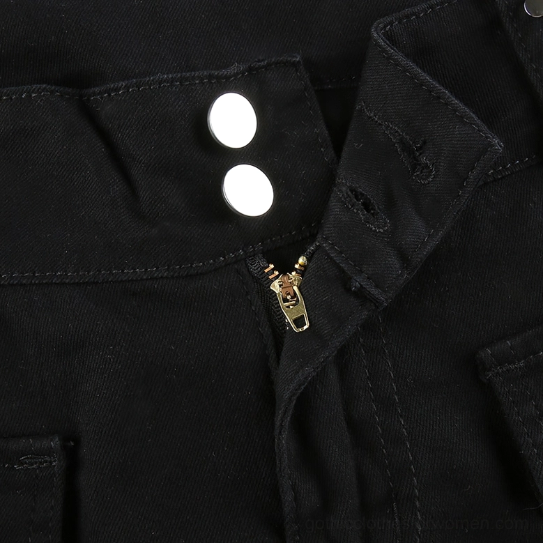Alternative flared black pants detail highlighting functional pockets and structural seaming