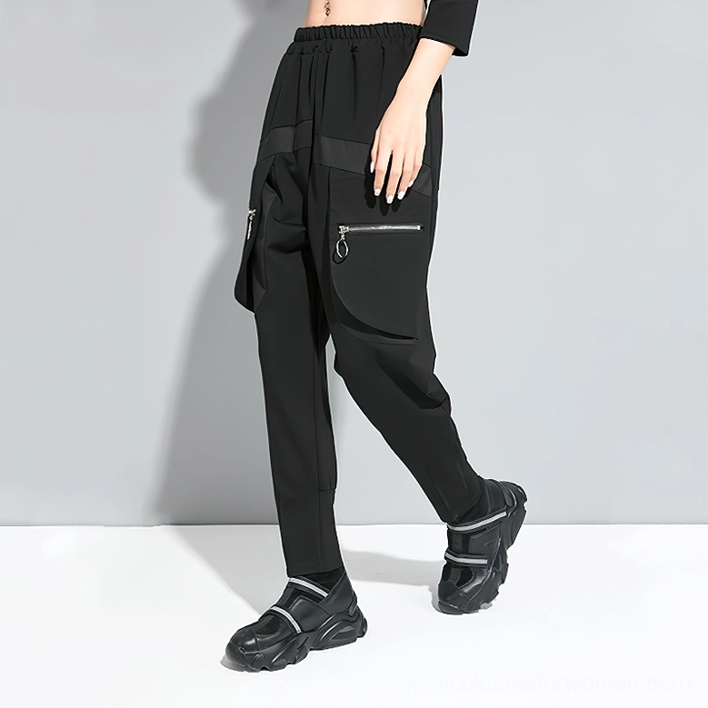Black gothic harem cargo pants side perspective showing elastic waist and drop crotch silhouette