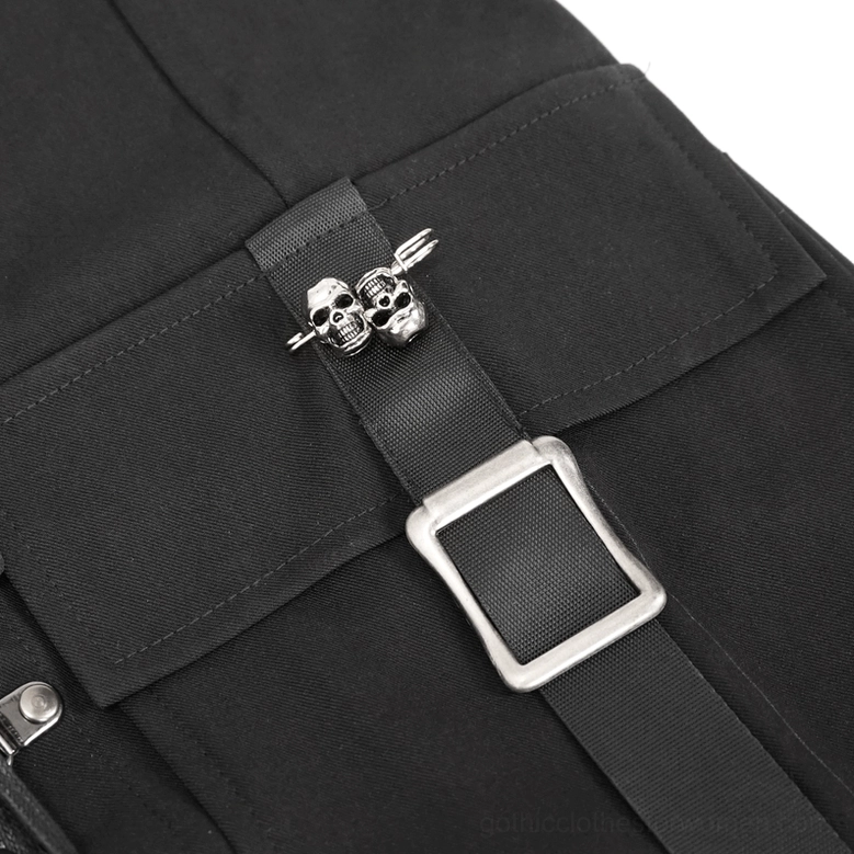 Skull-shaped metal buckle hardware detail on gothic cargo pants showing adjustable strap fastener and cargo pocket construction