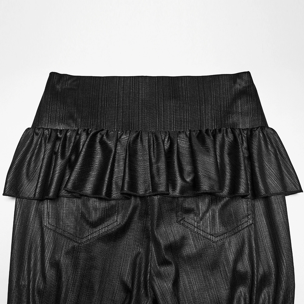 Close-up rear view of gothic pants waist detail showing single ruffle trim, wide elastic waistband, and structural design elements
