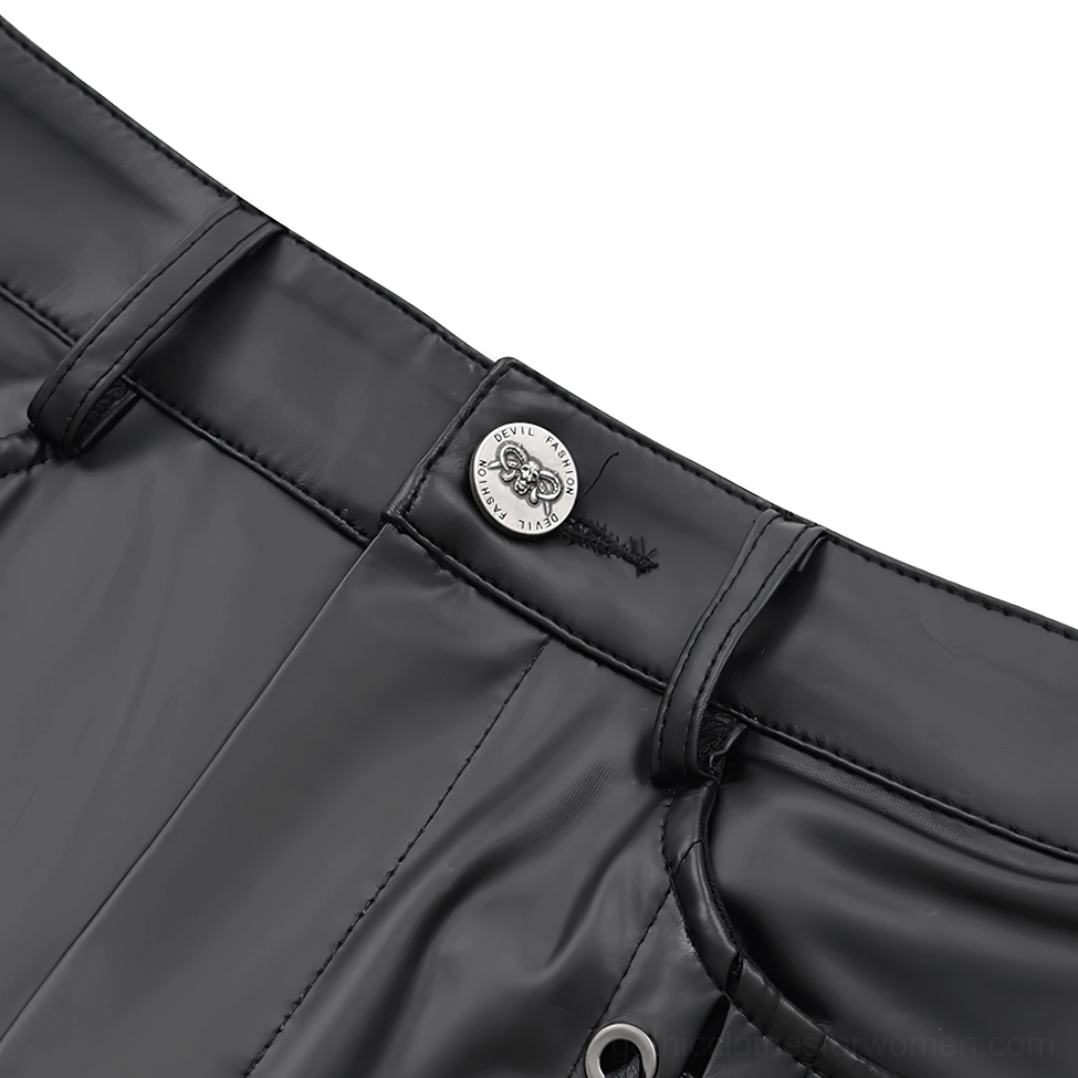 Close-up detail of black gothic pants waistband showing metal button, belt loops, synthetic leather material