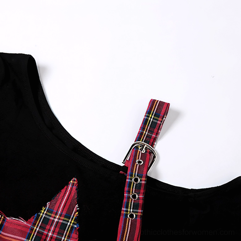 Product showcase of asymmetric gothic crop top highlighting patchwork construction, metal buckle details, and pentagram occult symbolism