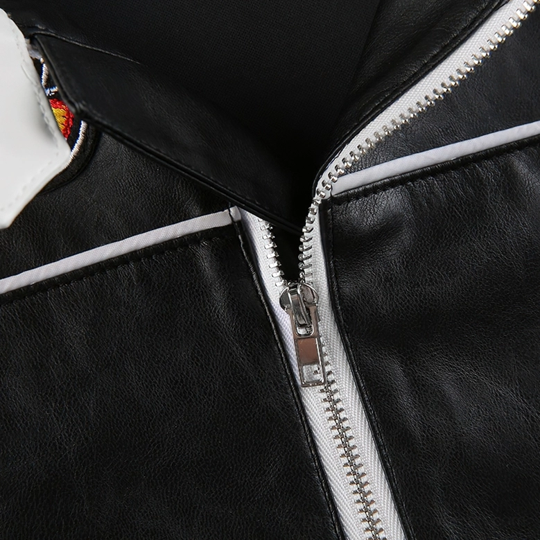 Three-quarter view of black and white gothic patchwork jacket on display showing sleeve patches and overall silhouette