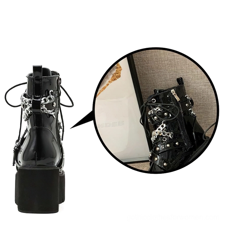 Black patent leather gothic boots with chain and rivet decorations detailed view of craftsmanship and design elements