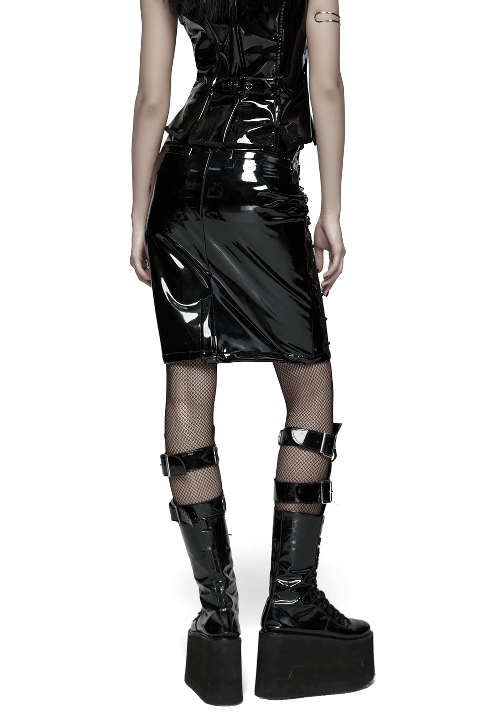 Black gothic patent leather skirt back view on model wearing fishnet stockings with rivet details and back zipper