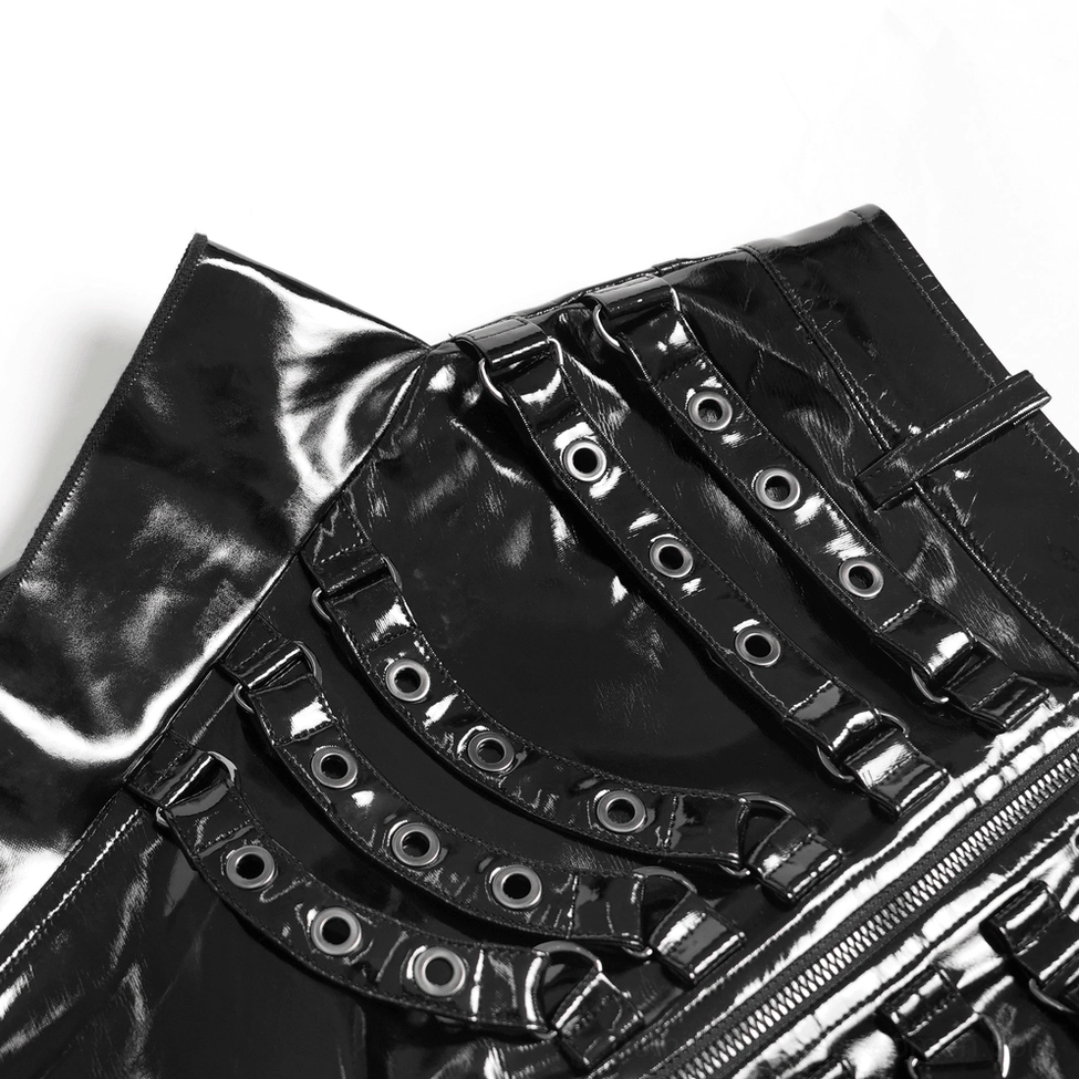 Side close-up detail of black patent leather gothic maxi skirt strap construction showing shiny patent finish and stitched strap details