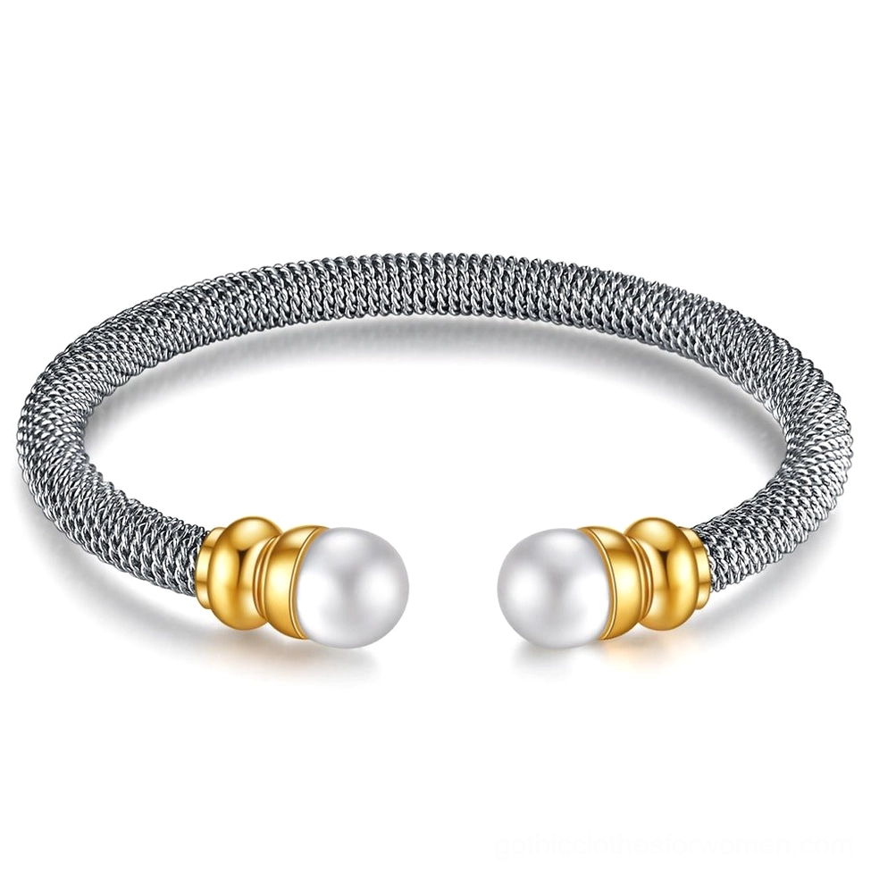 Dark silver tone open cuff bracelet with round simulated pearls and gothic aesthetic, overhead view