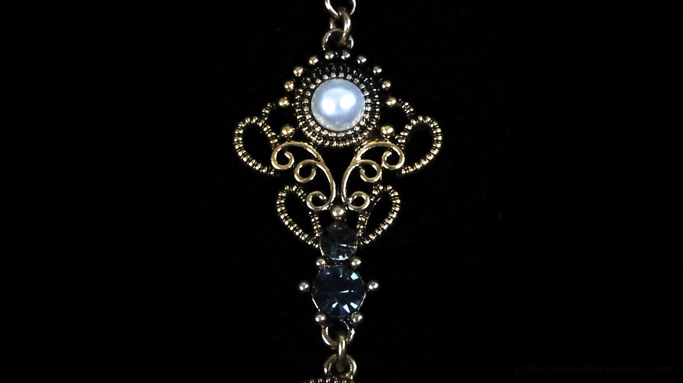 Gothic necklace alternative angle view, featuring lustrous pearls and ornate gemstone pendant, studio lighting