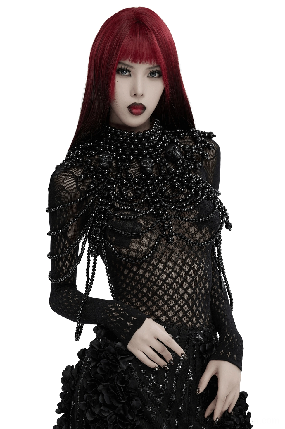Black pearl skull body harness chain worn by model with red and black hair, front view of gothic shoulder jewelry with multi-strand beaded design
