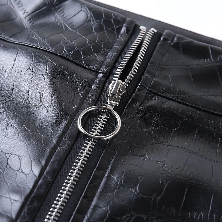 Model styling shot of black high-waist gothic faux leather pencil pants, showing versatile pairing options and overall silhouette