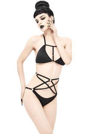 Gothic black pentagram harness bikini set worn by model with dark makeup, three-quarter left side view