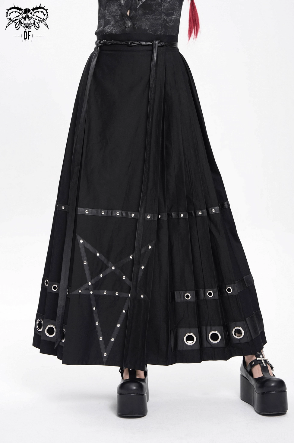 Black gothic floor-length maxi skirt with pentagram straps and metal grommets, three-quarter view angle