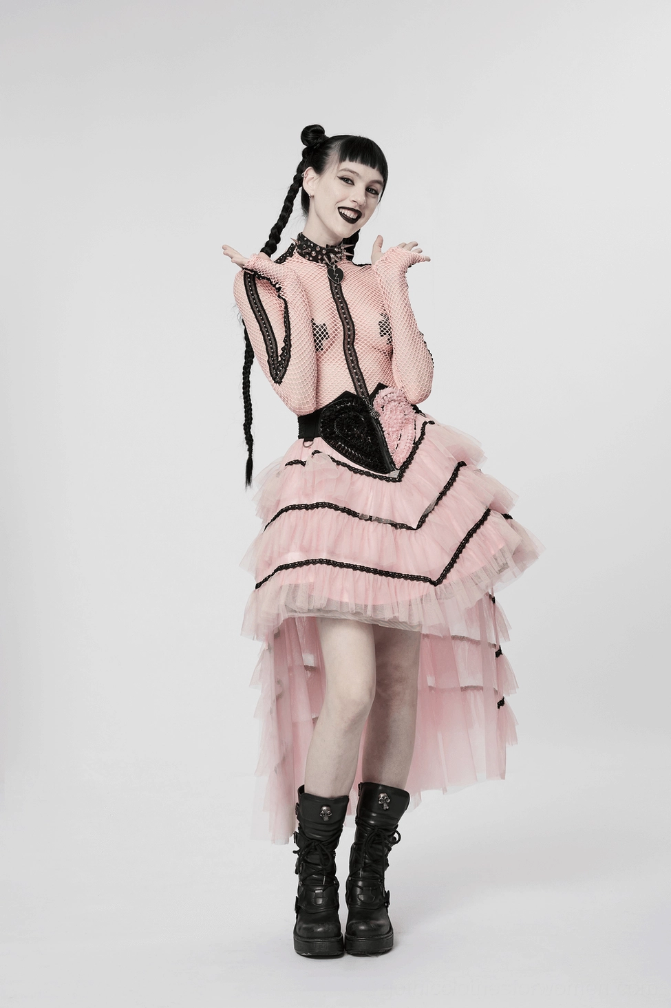 Pink ruffled mesh heart skirt styled with gothic fashion aesthetic, showing black elements and tulle layering for alternative subculture