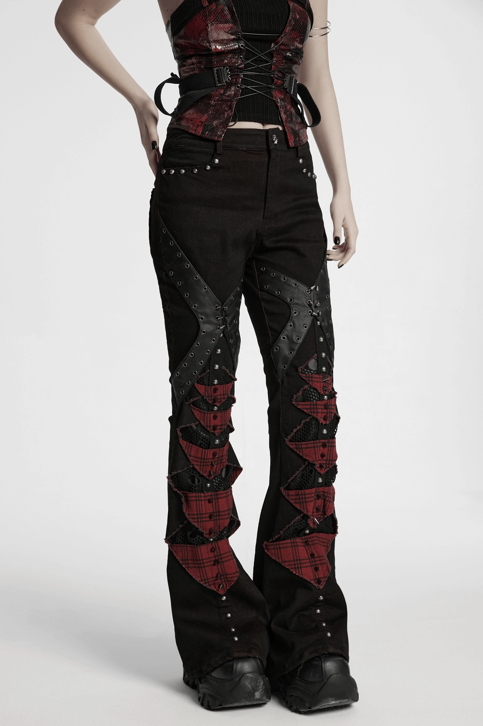 Gothic plaid flared pants with metal studs and mesh punk style on model