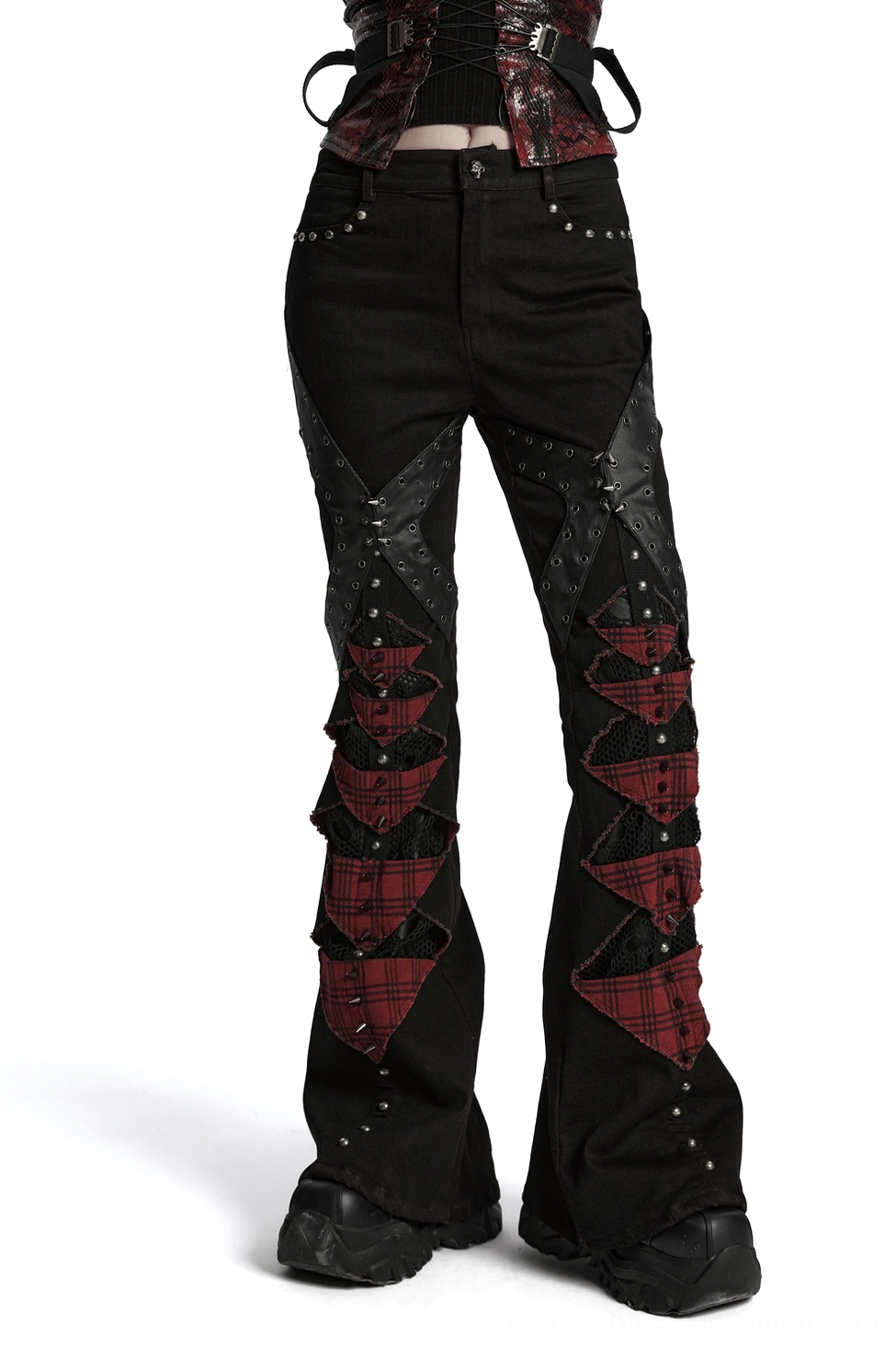 Gothic plaid flared pants with studs and mesh panels front side view on model
