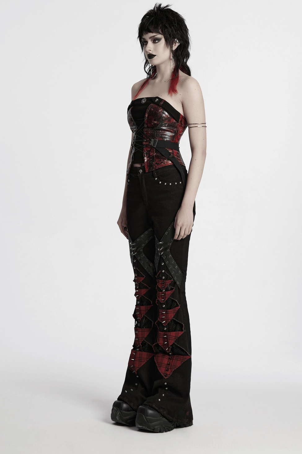 Gothic plaid flared pants with studs and red accents side angle