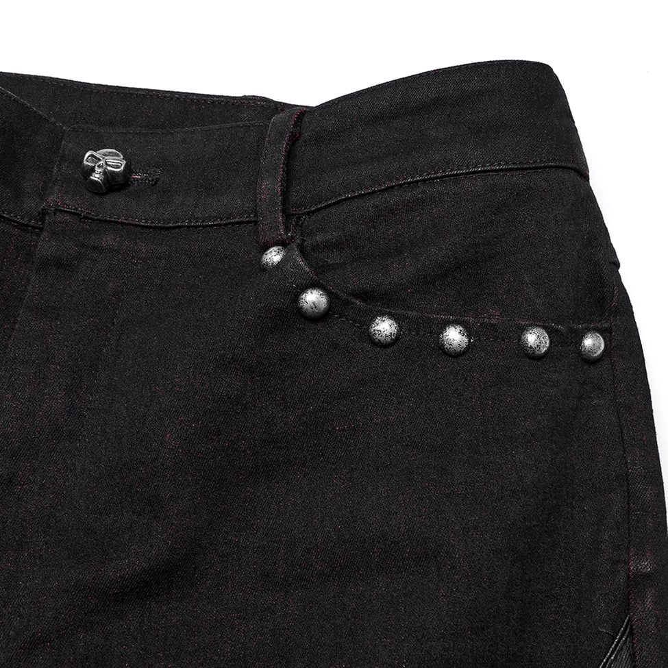 Gothic pants waistband close-up showing metal studs and button closure