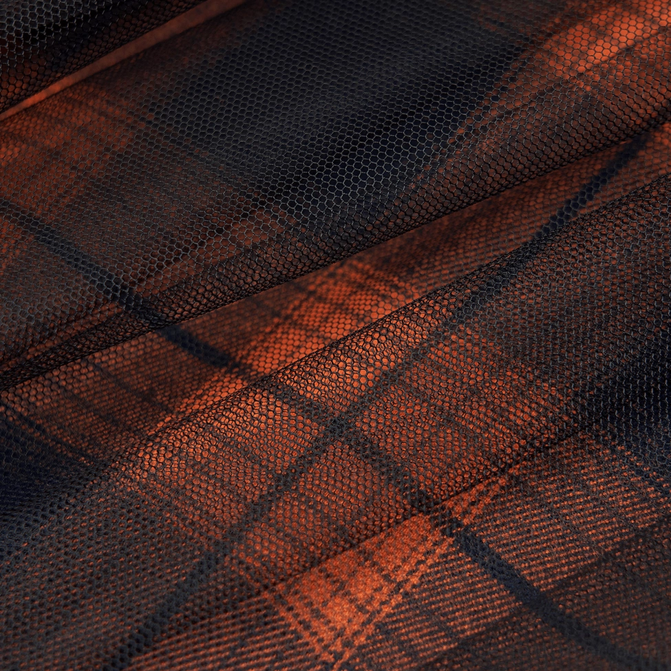 Alternative angle view of black and orange plaid gothic mesh skirt demonstrating high waist fit and decorative hardware placement