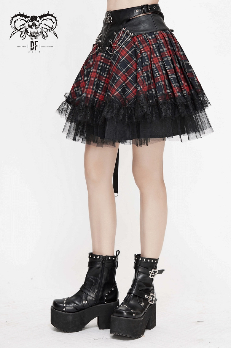 Gothic plaid skirt hem detail, mesh ruffle layering and chain embellishment on red-black tartan