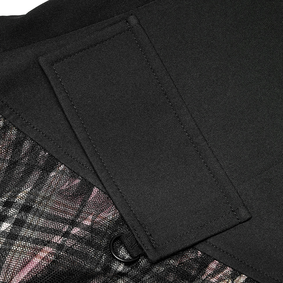 Detail shot of stitched side pocket flap and metal D-ring hardware on black plaid gothic skirt