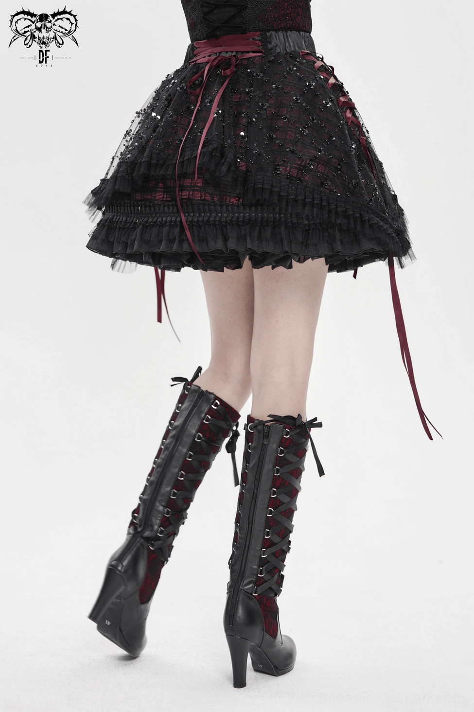 Gothic plaid tulle skirt styled look showing dark academia aesthetic with alternative fashion sensibility