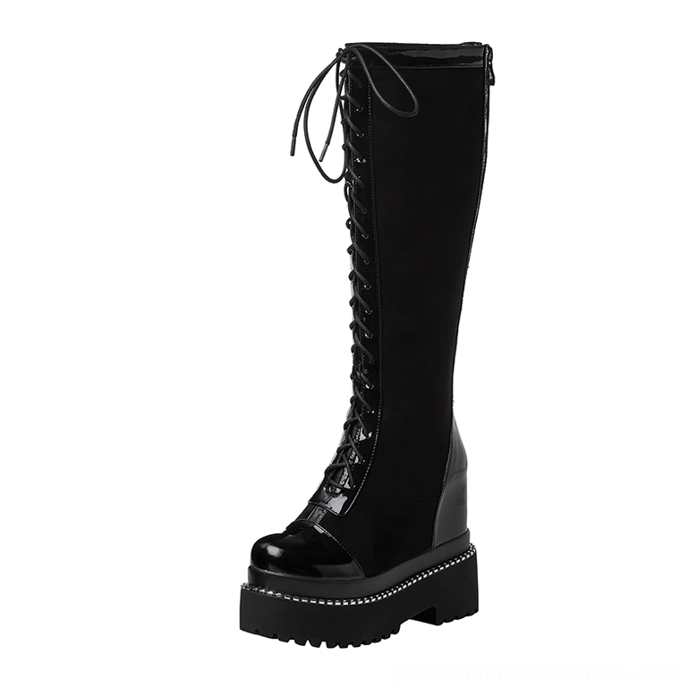 Black gothic platform knee-high boot right side view showing lace-up design and patent leather heel trim detailing