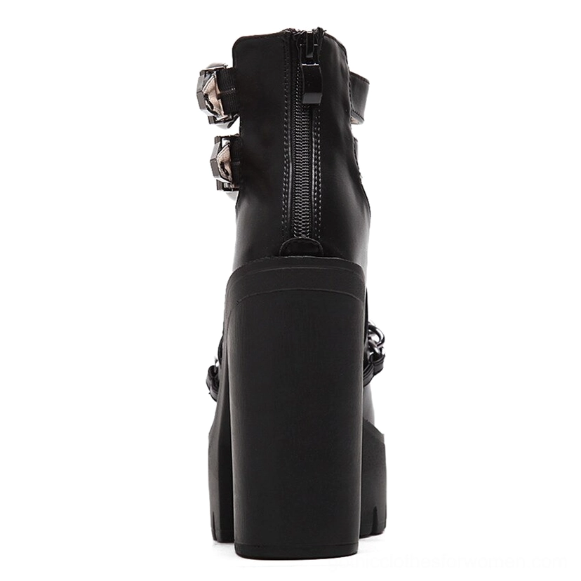 Black gothic platform boot rear view showing exposed back zipper and thick platform sole