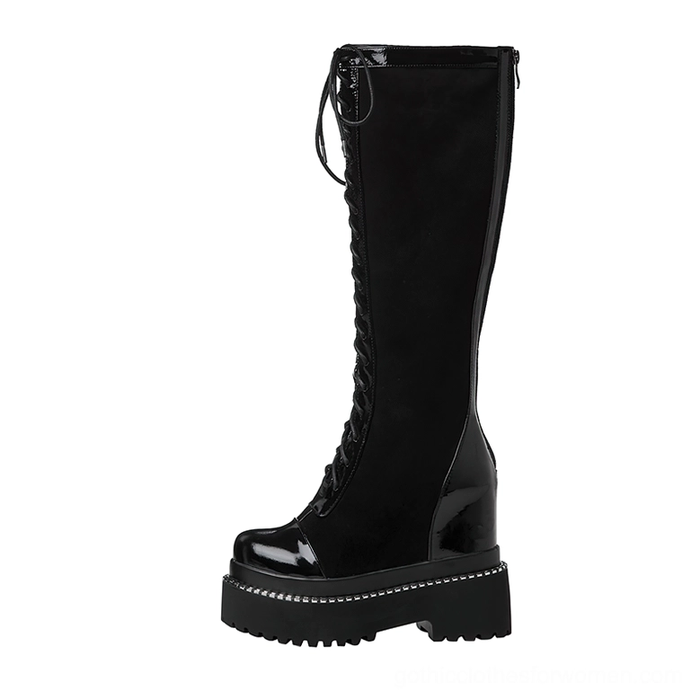 Single black gothic platform boot side profile view displaying hidden side zipper closure and wedge heel silhouette