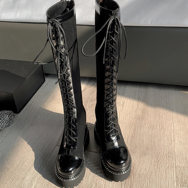 Black gothic platform knee-high boots back view showcasing lacing pattern and structured heel construction for alternative fashion