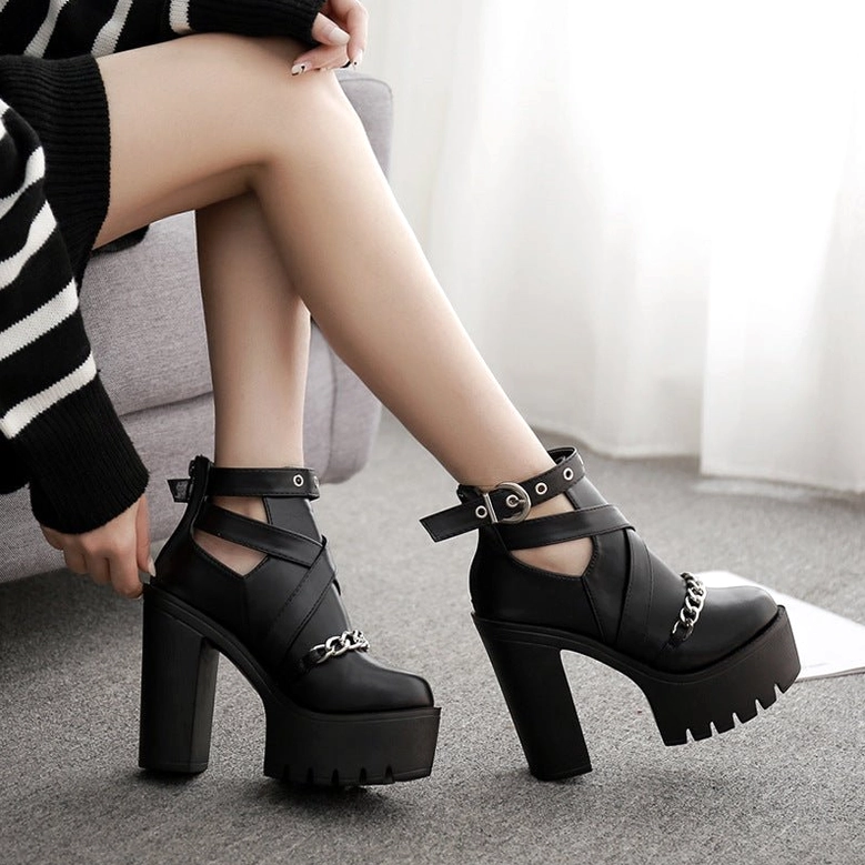 Women's gothic platform ankle boots featuring chain embellishment and metal hardware design elements